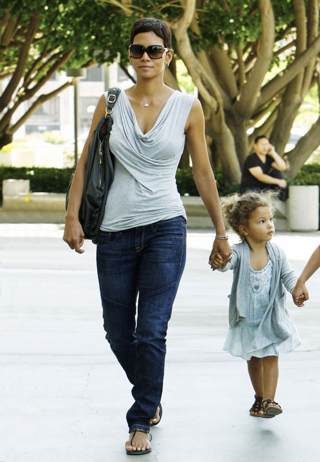 Halle Berry, gray swoop neck top, gray blouse, sunglasses, jeans, black purse, black tote